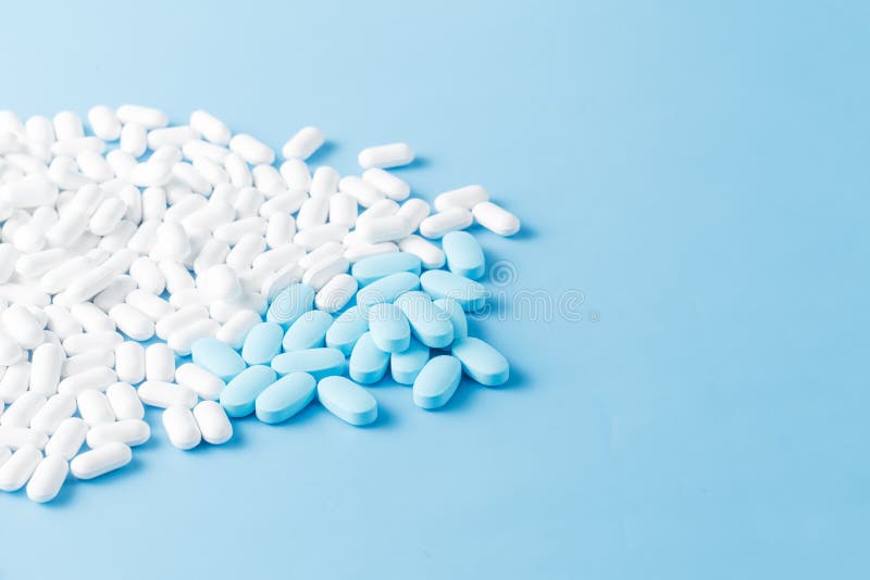 Blue and white medicine tablets antibiotic pills. royalty free stock photos
