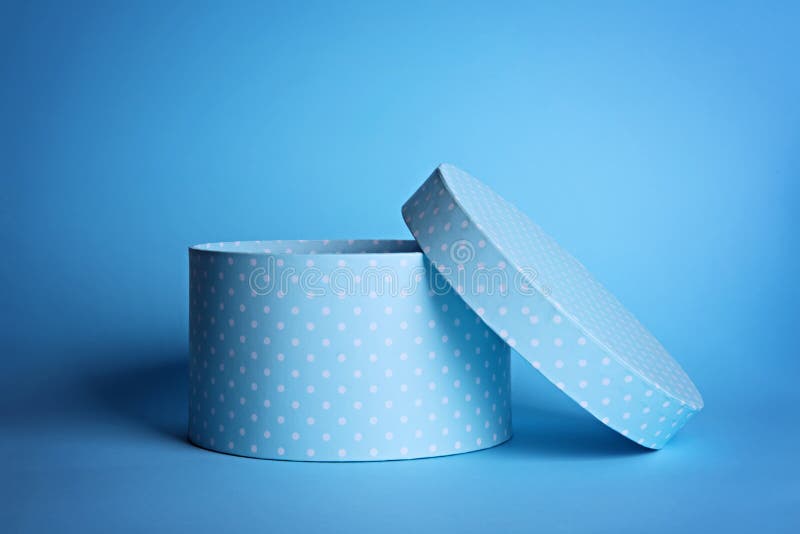 Blue and white polka dot round gift box.