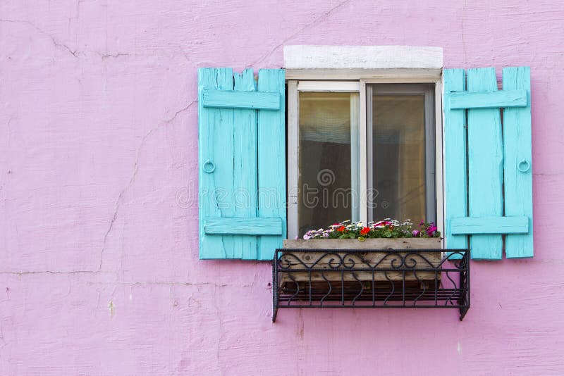 Blue window on the pink wall with space