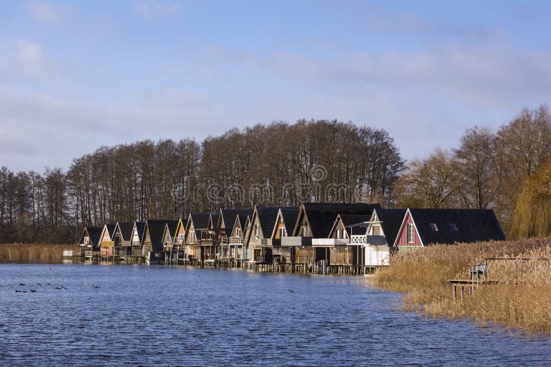 View of some boathouses. Idyllic situatuion at the Lake Muritz in Mecklenburg, Germany