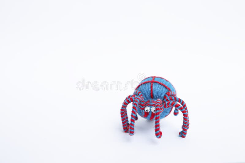 Blue yarn spider isolate on white background, Halloween decorate item