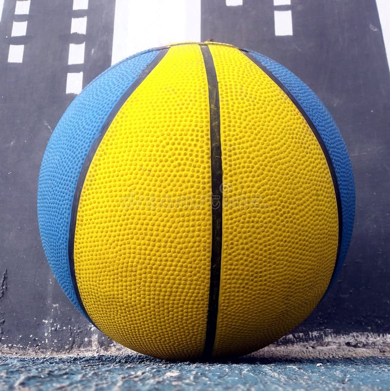 Download A Basketball Player Is Shown In A Yellow And Blue