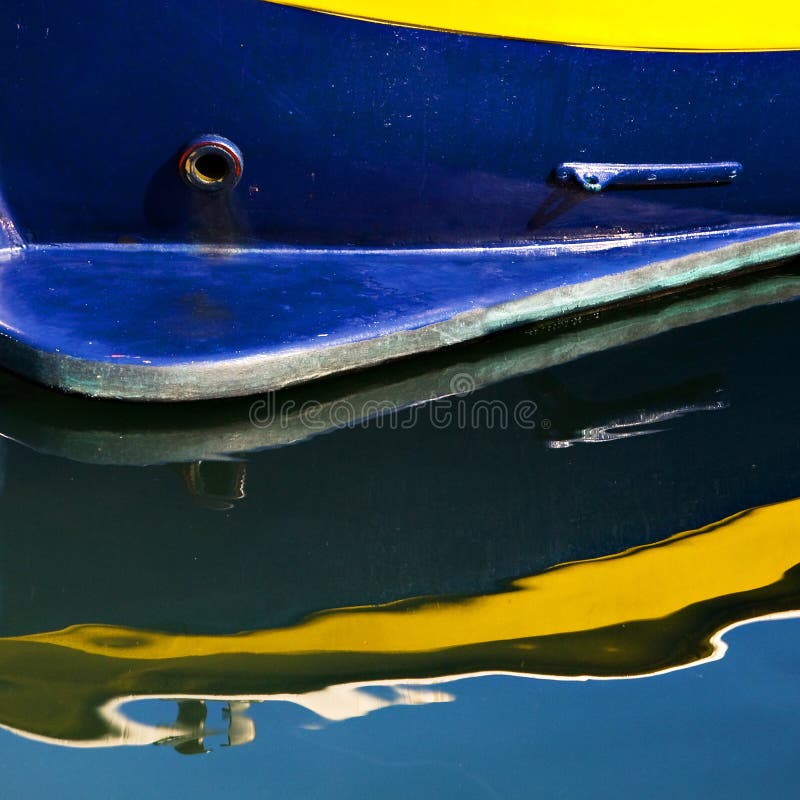 Blue and Yellow Boat with Reflection royalty free stock photos