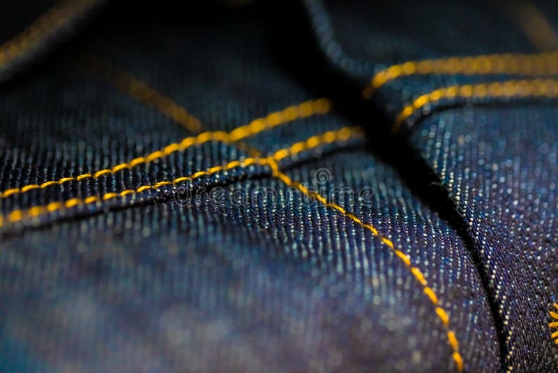 Blue and Yellow Denim with stitching royalty free stock photos