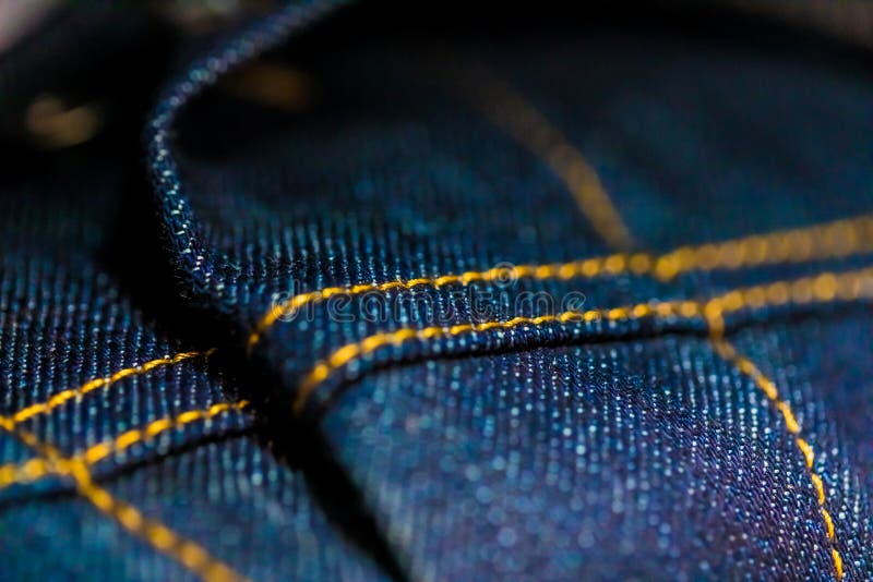 Blue and Yellow Denim with stitching royalty free stock photography