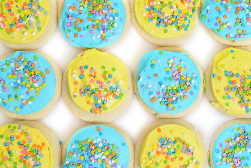 Top view of blue and yellow easter cookie background