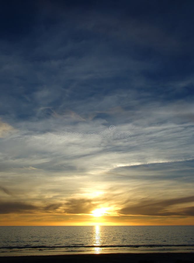 Blue Yellow Sunset stock photo. Image of wave, clouds, calm - 95252