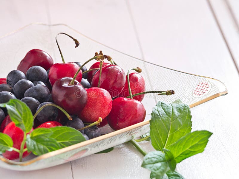 Cherries and blueberries stock image. Image of seasonal 31480487