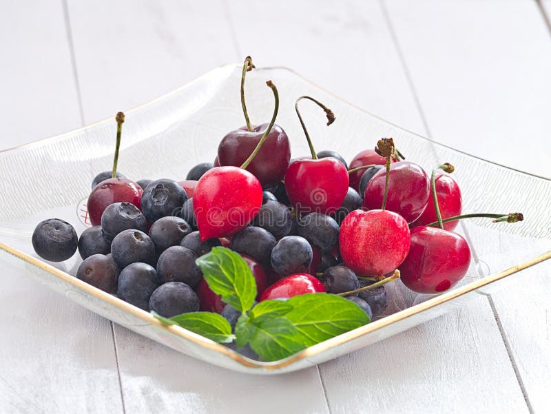 Cherries and blueberries stock image. Image of seasonal 31480487