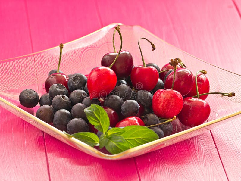 Cherries and blueberries stock image. Image of seasonal 31480487