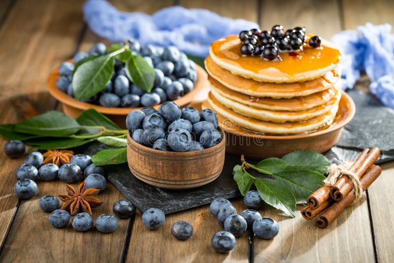 Blueberries in a plate and pancakes