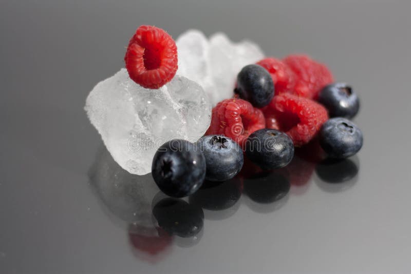 Blueberries and raspberries on black background royalty free stock photo Blueberries and raspberries on black background royalty free stock photo