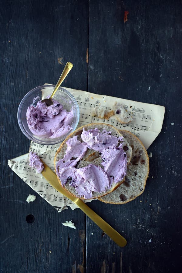 Blueberry Bagels With Blueberry Cream Cheese On Rustic Table With Music Sheets Vertical Layout ...