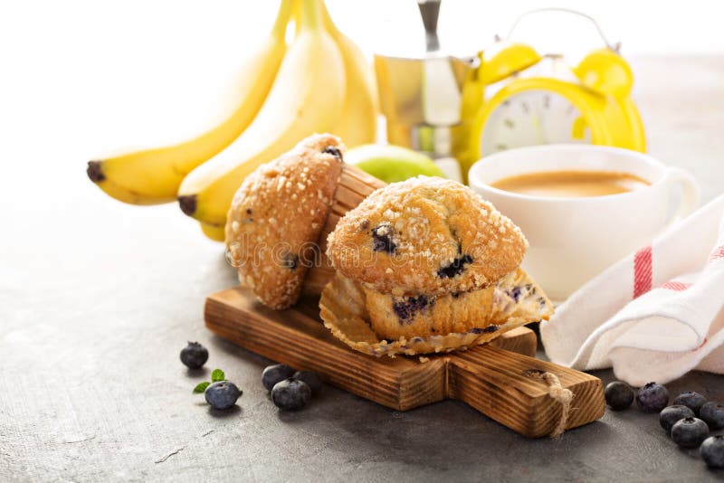 Blueberry and banana muffins with coffee for breakfast