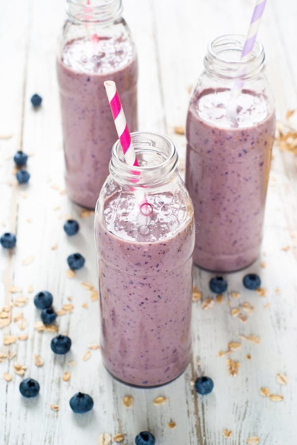 Blueberry milkshake in the bottles stock images Blueberry milkshake in the bottles stock images