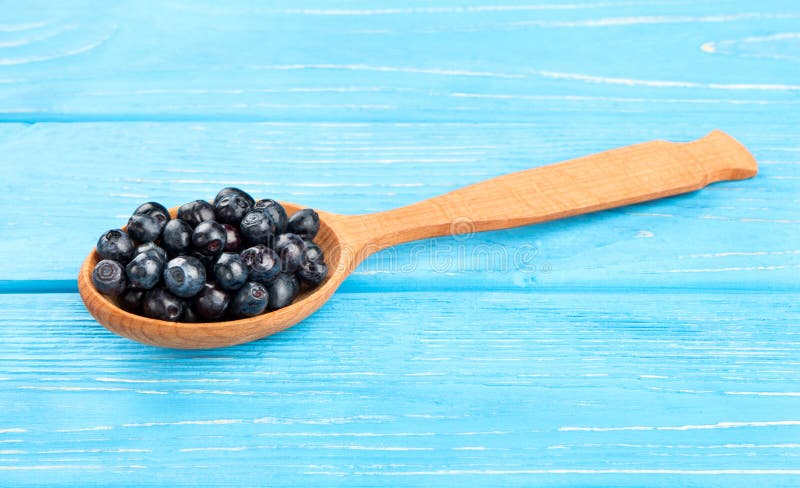 Blueberry in spoon stock photo. Image of background, healthy - 74728776