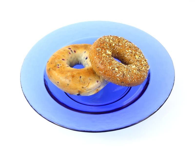 Blueberry and Whole Wheat Grain Bagels on Blue Dis Stock Image Image