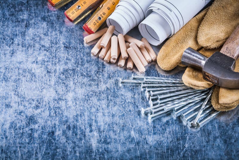 Blueprints hammer safety gloves wooden meter construction nails.