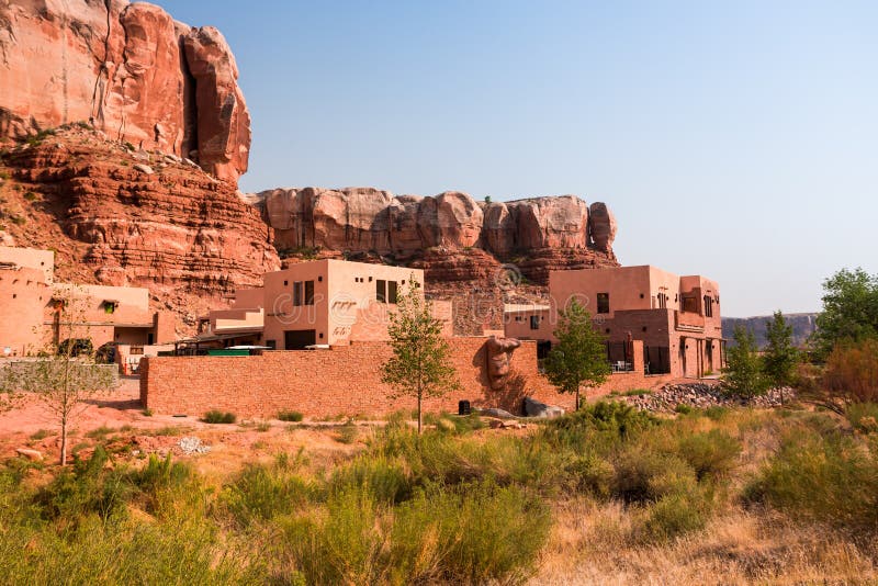 Bluff Dwelling Resort at the foot of orange sandstone cliffs