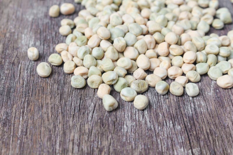 Blur Blurred Dry Sugar Pea Seed, Green Nuts on the Wood, for Ba Stock