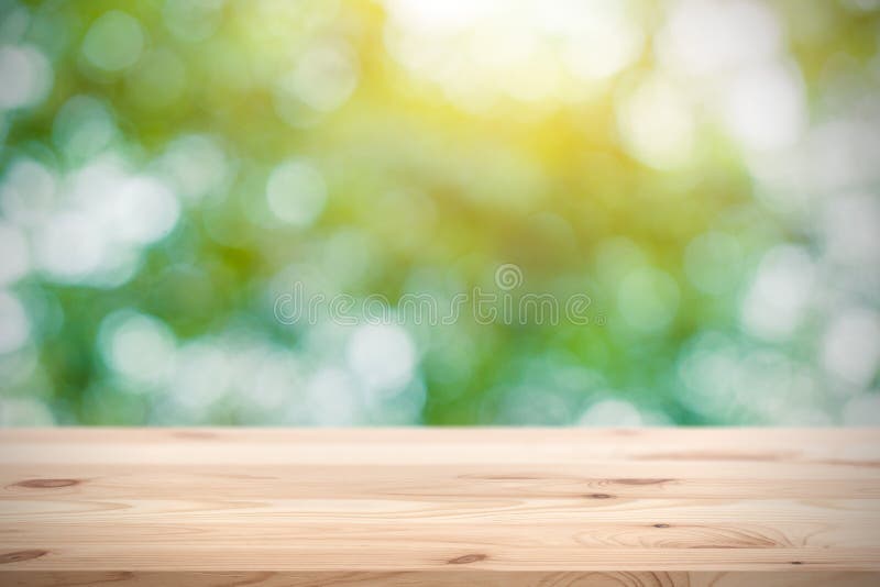 Blur green with wooden table space for products display.