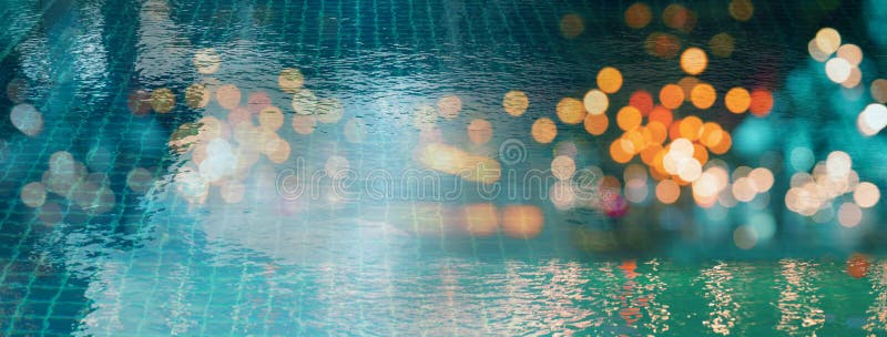 Blur light of bar or pub reflection on blue water swimming pool summer party at night banner background