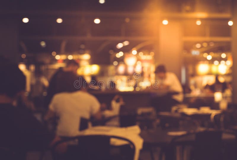 Blur of people in night cafe,restaurant with lighting background