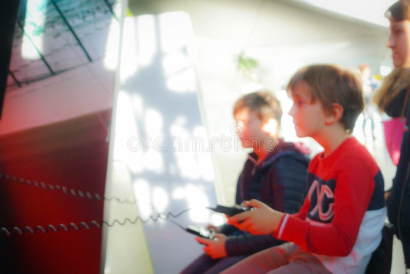 Blur picture of children playing game with remote device stock images Blur picture of children playing game with remote device stock images