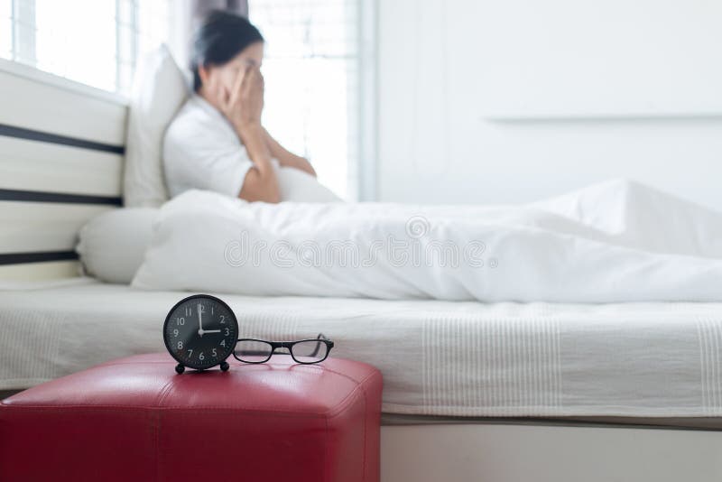 Blured of asian elderly woman sitting on bedroom with depression of lonely have a headache,Mental disorder health care concept royalty free stock image Blured of asian elderly woman sitting on bedroom with depression of lonely have a headache,Mental disorder health care concept royalty free stock image