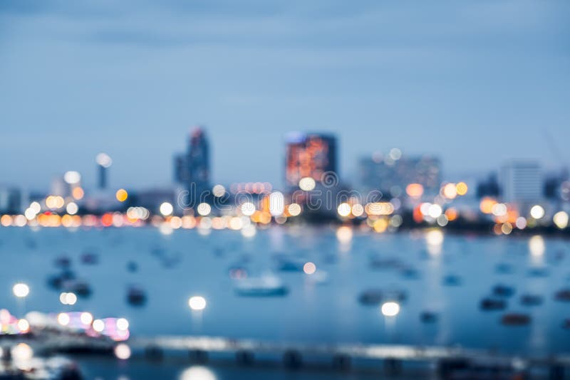 Blurred abstract background of office building at sea harbour at evening time,urban life