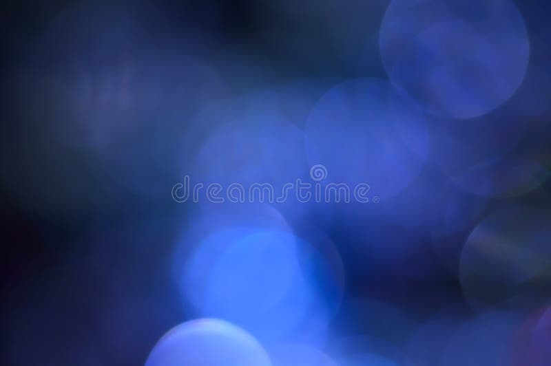 Blurred, bokeh blue lights background. Abstract sparkles royalty free stock photo
