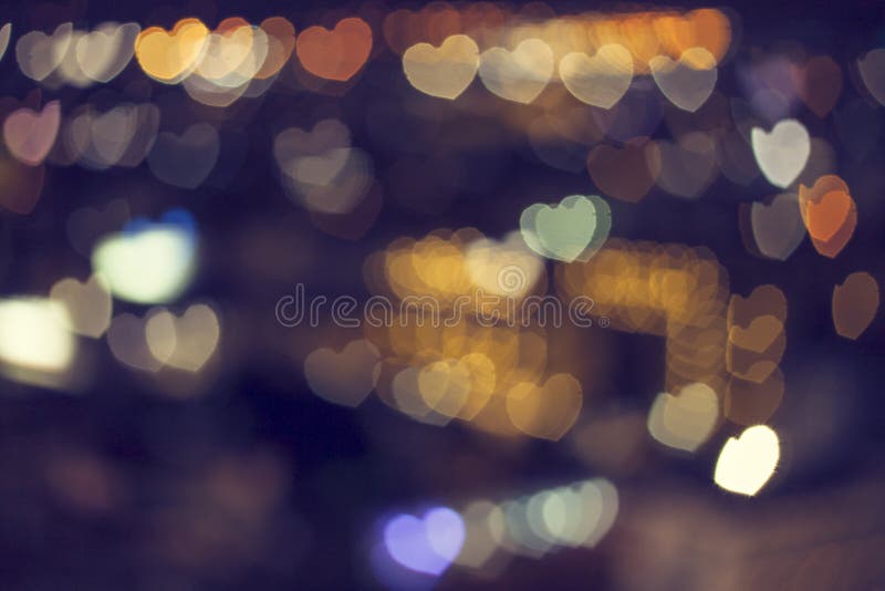 Blurred bokeh light heart background.