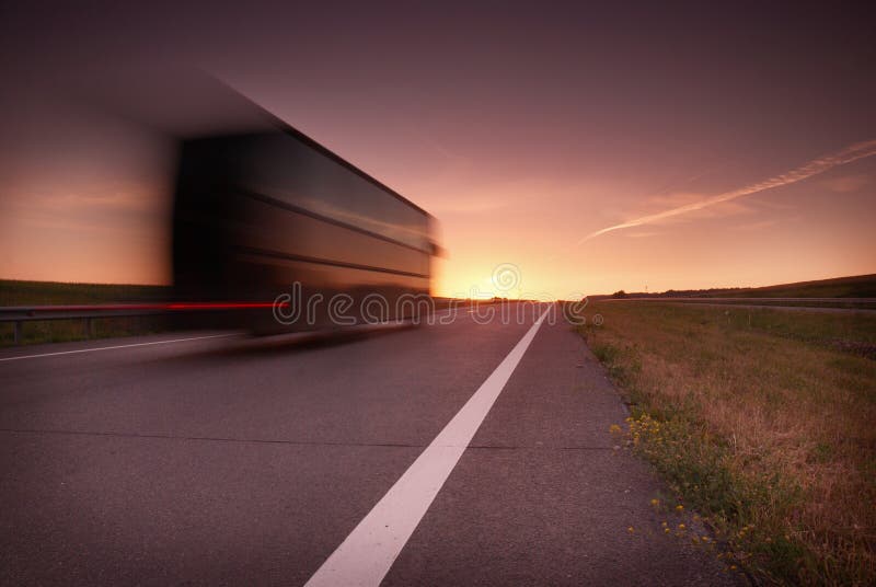 Blurred bus at high speed on the highway at sunset royalty free stock images Blurred bus at high speed on the highway at sunset royalty free stock images