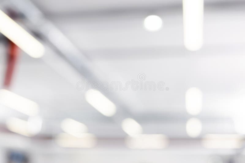 Blurred business background. Blur warehouse with bokeh light background. Blurred background Lights and ventilation system in long royalty free stock photos Blurred business background. Blur warehouse with bokeh light background. Blurred background Lights and ventilation system in long royalty free stock photos