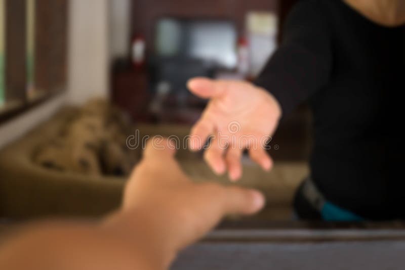 Blurred concept male hands reaching out to help woman royalty free stock image Blurred concept male hands reaching out to help woman royalty free stock image