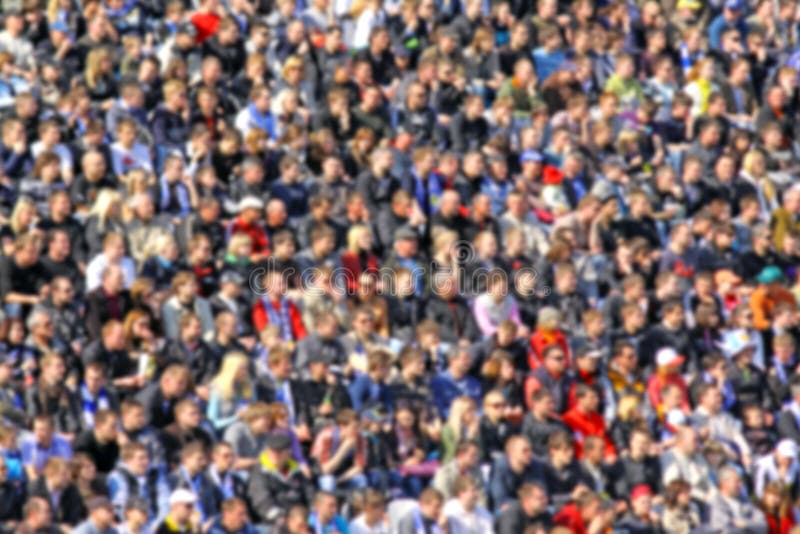 Blurred crowd of spectators on a stadium tribune