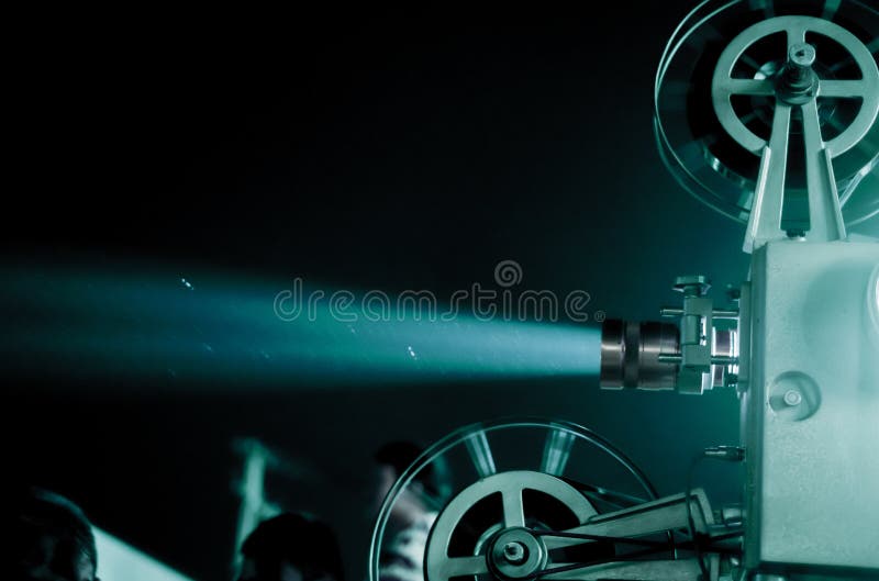 blurred focus of movie projector and beam light for vintage feeling in the outdoor theater