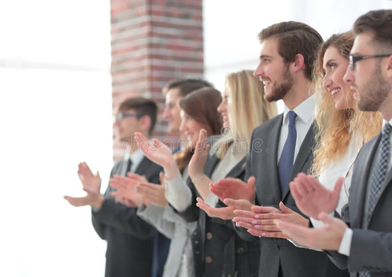Blurred image of business team applauding