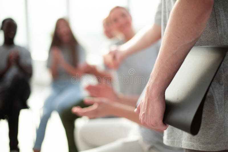 Blurred image of a group of young people sitting in a circle royalty free stock photography