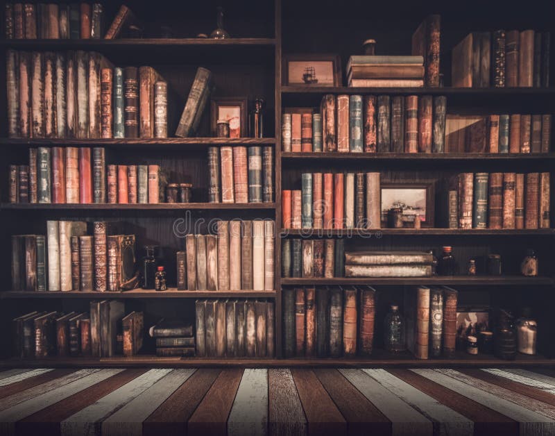 Vertical closeup of the antique books on the bookshelf. Stock