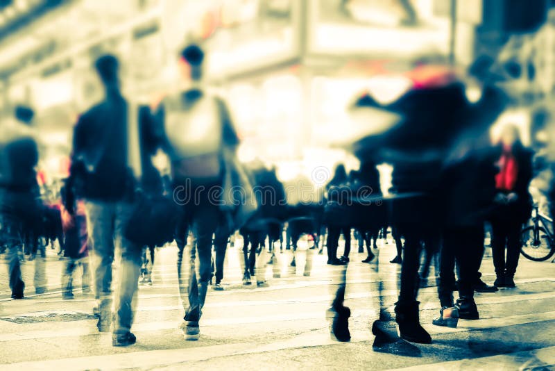 Blurred image of people moving in crowded night city street. Art toning abstract urban background. Hong Kong. Blurred image of people moving in crowded night city street. Art toning abstract urban background. Hong Kong