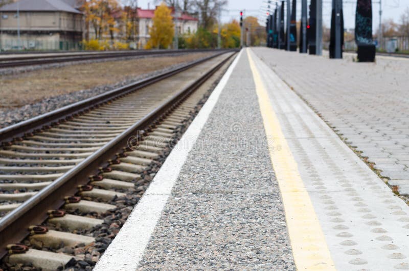 Blurred image of railway track and rail platform