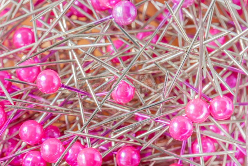 Blurred Photo of Pink Sewing Pins in the Box. Stock Photo Image of