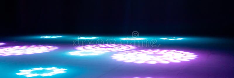 Blurred Rays of Light on Disco Floor. Pink Blue Neon Searchlight Lights