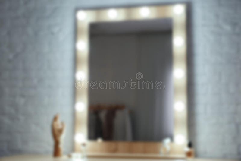 Blurred view of makeup mirror on table stock photos