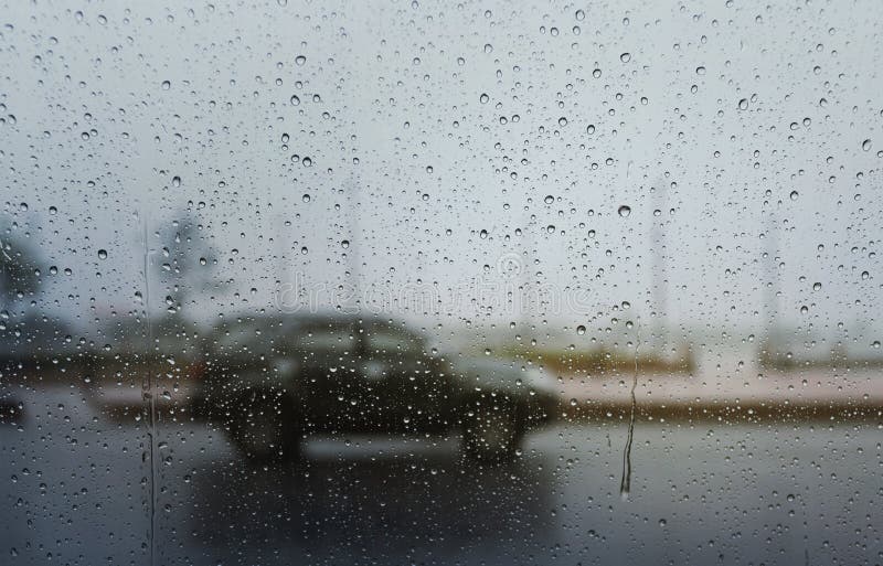 Blurry Car in Hard Rainfall,view through the Window. Stock Photo