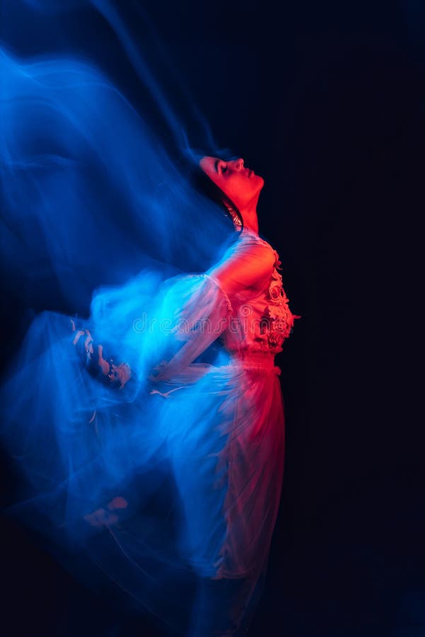 Blurry Girl in a Dress is Dancing on a Dark Background Stock Image - Image  of darkness, depressed: 176118425