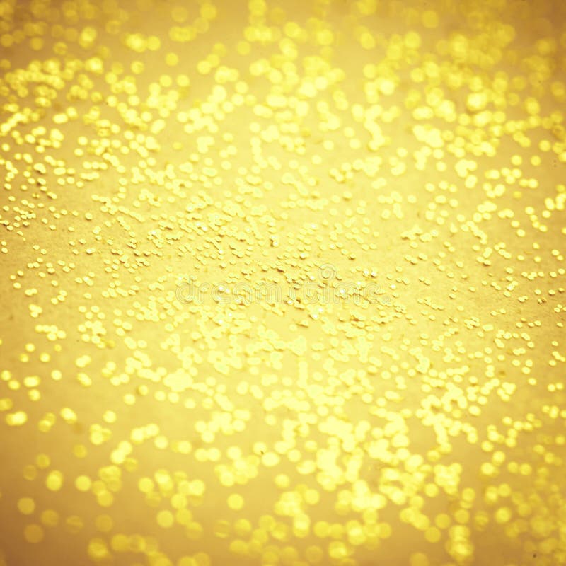 Blurry Gold sparkle texture. Abstract Bokeh Golden glitter background. Gold metal textured foil effect.