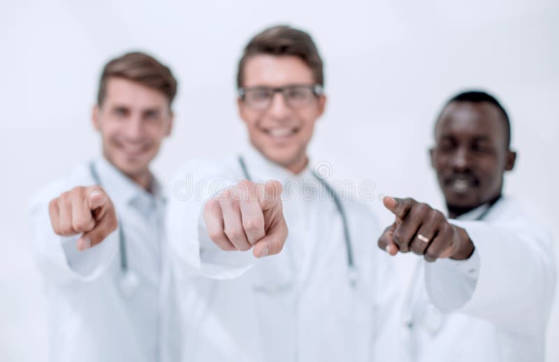 Blurry image of a group of doctors pointing at you stock images
