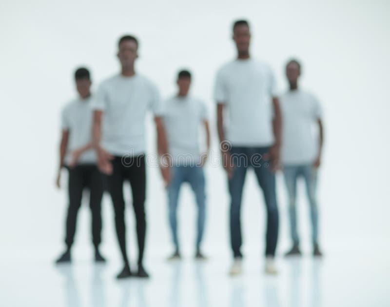 Blurry image of a group of young men in white t-shirts stock images